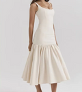 Beige dress with a slit on a white background