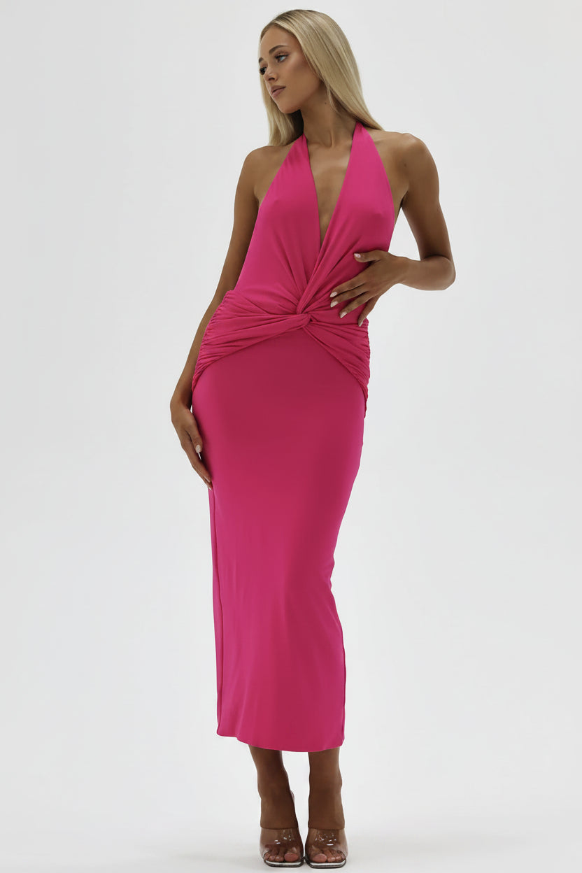Woman wearing a bright pink dress on a white background