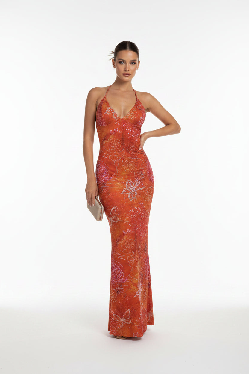 Orange floral patterned dress on a mannequin against a white background