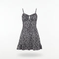 Black floral dress on a hanger against a white background